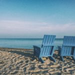 The picture of two beach chairs represents retirement when you might need a life care manager.