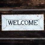 The picture shows a welcome sign to represent welcoming two new employees to the Sensible team.