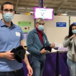 The picture shows Josh, Rick, and Erica sorting clothes at the Cradles to Crayons warehouse.