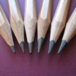 The picture shows the tips of pencils to represent financial tips.
