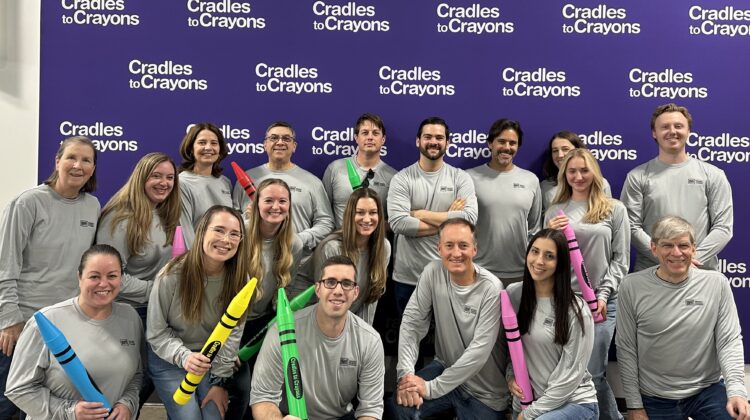 The picture is of the entire Sensible Financial staff at Cradles to Crayons, where they volunteer as a team.