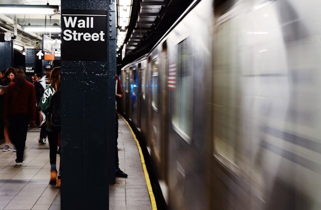 The image shows a sign for Wall Street to represent stock and bond returns.