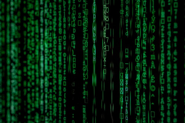The picture shows lines of code to represent the digital assets you would put in a digital estate plan.