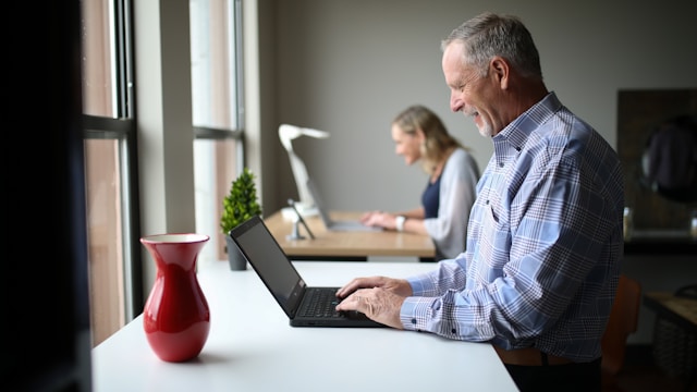 The picture shows a man in his 50s or 60s on a laptop because he is logging into his Social Security account.