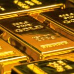 The picture shows several gold bars.